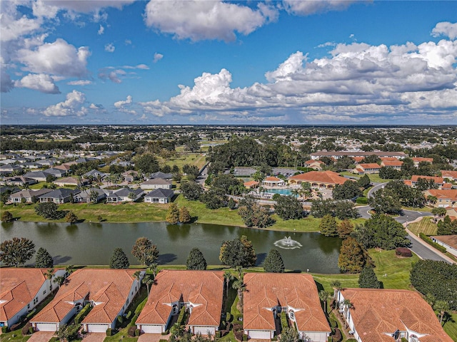 drone / aerial view featuring a water view and a residential view