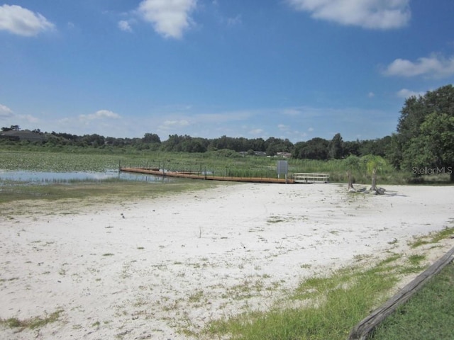 view of yard featuring a water view and a rural view