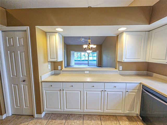 kitchen featuring dishwasher, decorative light fixtures, an inviting chandelier, light countertops, and white cabinetry