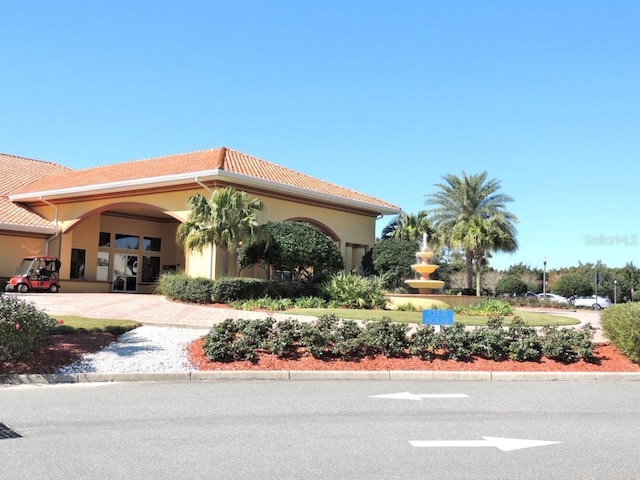 exterior space featuring decorative driveway