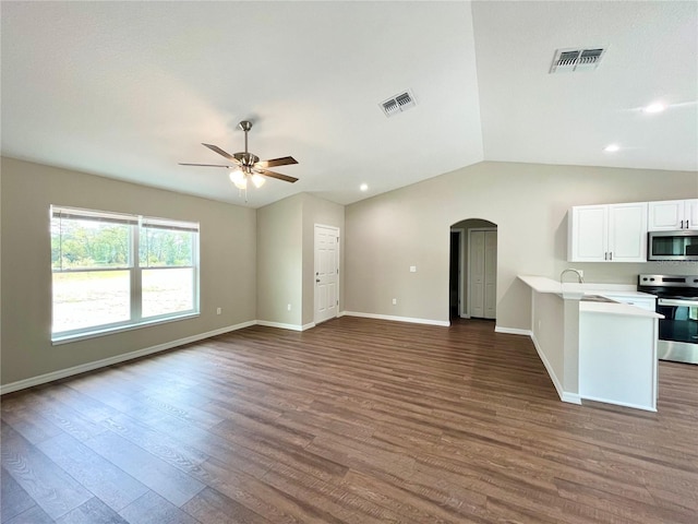 kitchen with open floor plan, light countertops, appliances with stainless steel finishes, and visible vents