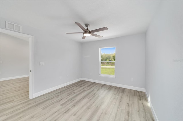 unfurnished room with baseboards, ceiling fan, light wood-style flooring, and visible vents
