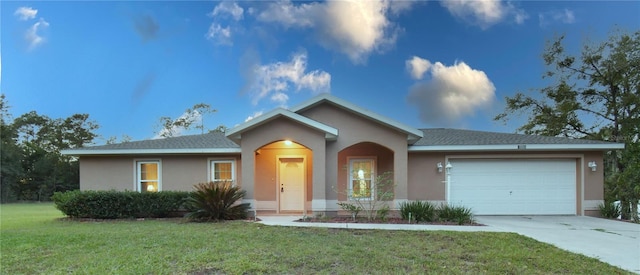 single story home with a front lawn and a garage