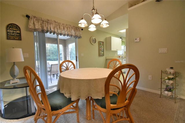 dining area with a notable chandelier and carpet flooring