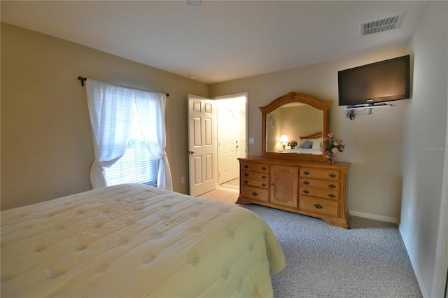 bedroom featuring light colored carpet