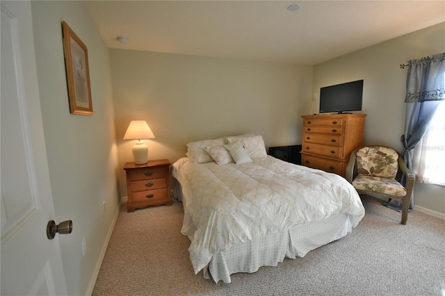 bedroom with light colored carpet