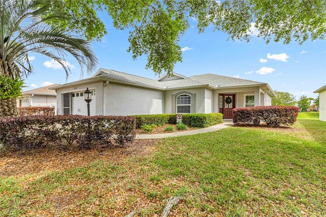 ranch-style house with a garage and a front lawn