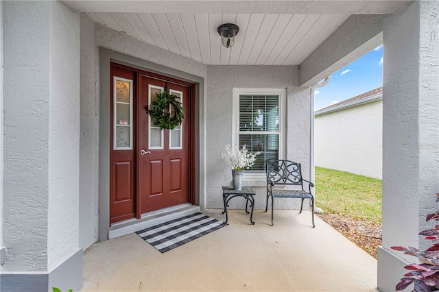 entrance to property featuring a porch