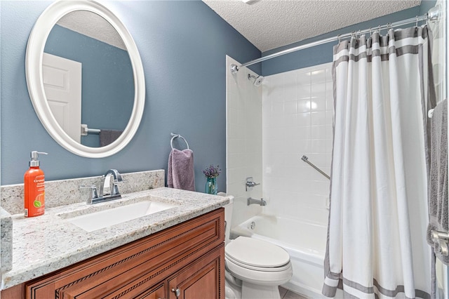 full bathroom featuring vanity, toilet, a textured ceiling, and shower / tub combo