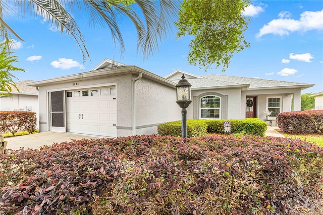 single story home with a garage