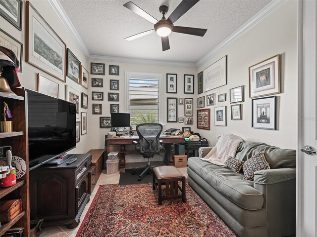 tiled office featuring ornamental molding, a textured ceiling, and ceiling fan