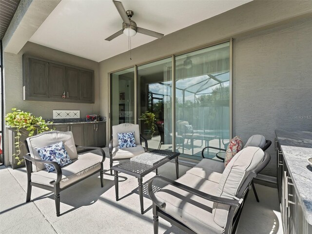 view of patio featuring an outdoor living space and ceiling fan