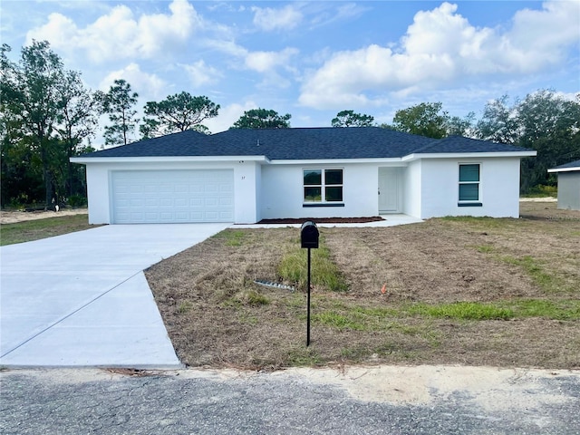 ranch-style home with a garage, concrete driveway, a shingled roof, and stucco siding