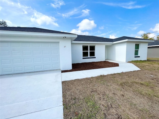 single story home featuring a garage