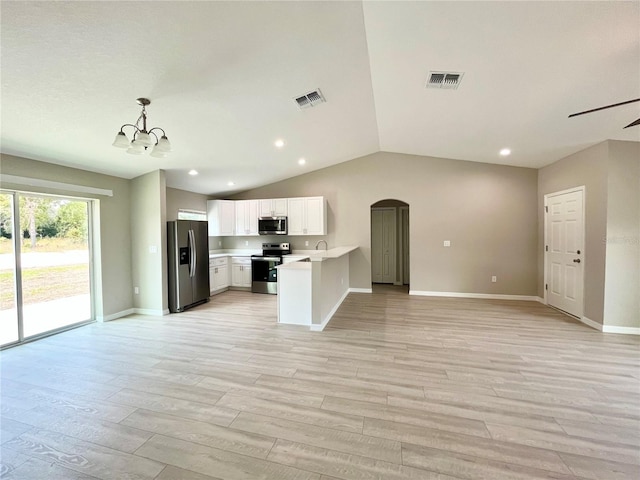 kitchen with visible vents, open floor plan, stainless steel appliances, light countertops, and white cabinetry