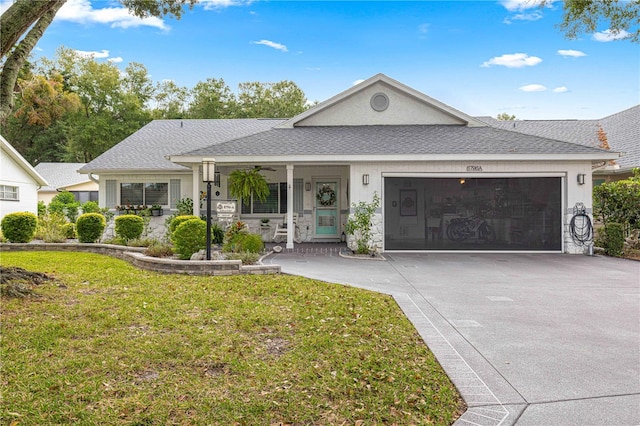 ranch-style house with a front lawn, covered porch, and a garage