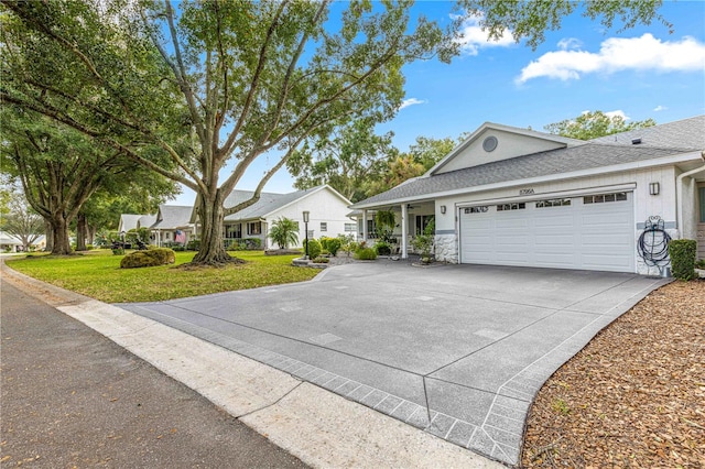 view of front facade featuring a front yard and a garage