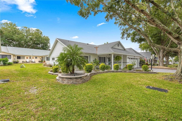 view of front facade featuring a front yard and a garage