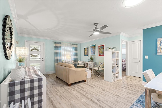 living room featuring light hardwood / wood-style floors, ornamental molding, and ceiling fan