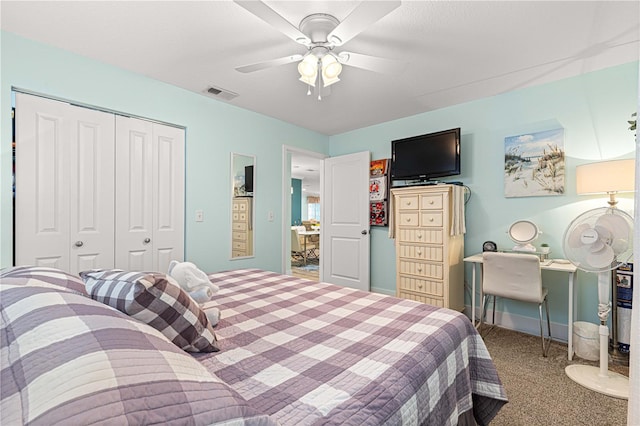 carpeted bedroom featuring a closet and ceiling fan