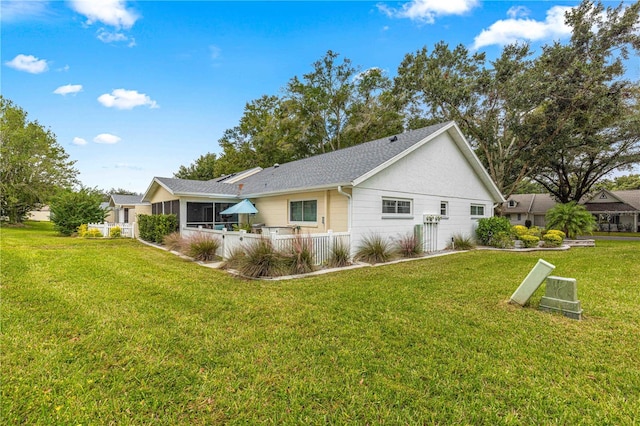 view of home's exterior with a lawn