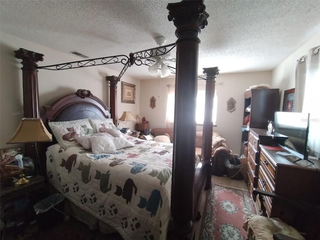 bedroom featuring a textured ceiling