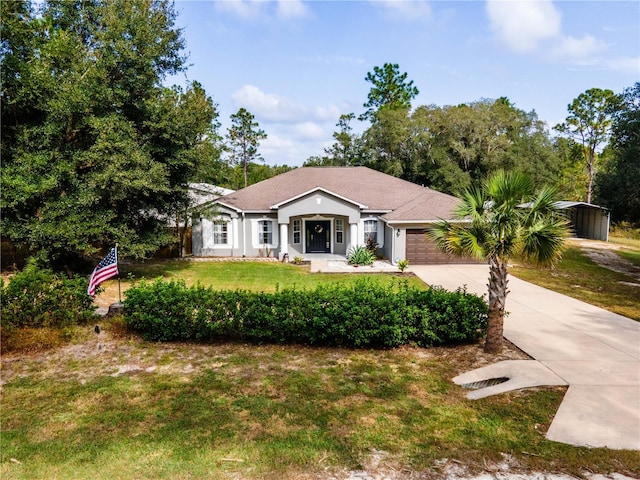 ranch-style home with a front yard and a garage