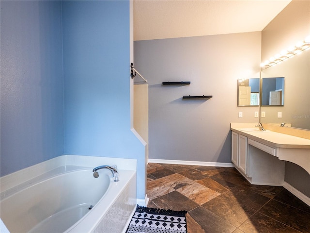 bathroom featuring vanity and a bath