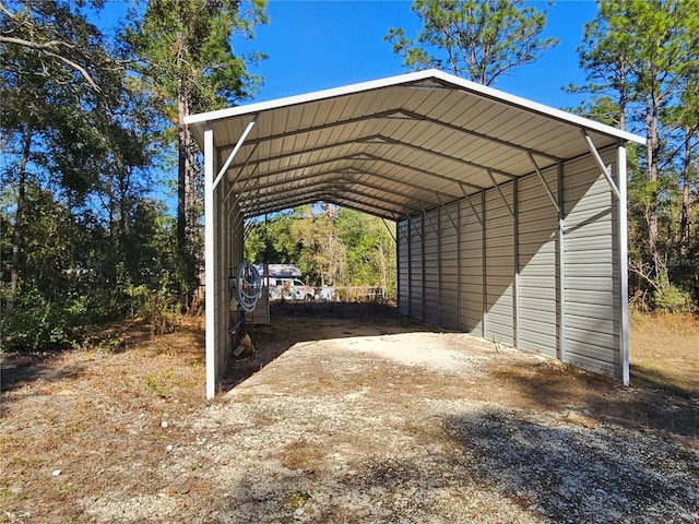 view of parking / parking lot featuring a carport