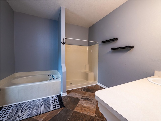 12805 SW 64th Ln, Ocala, FL 34481 - bathroom with a shower, a bath, baseboards, a textured ceiling, and a sink