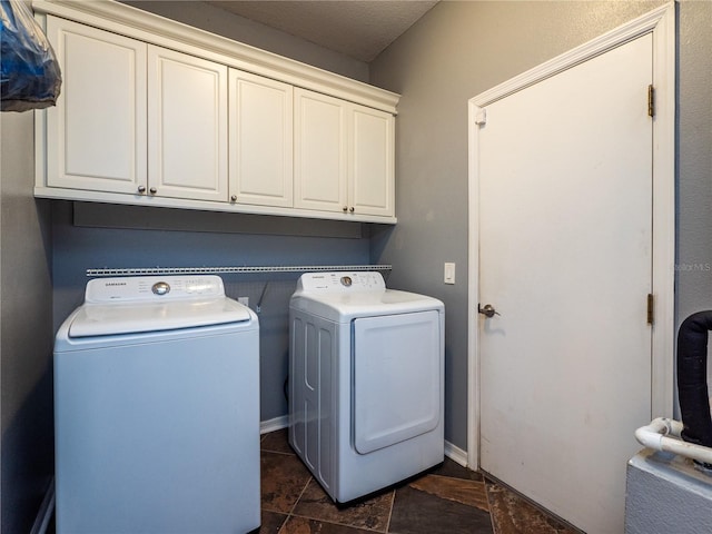12805 SW 64th Ln, Ocala, FL 34481 - laundry room with separate washer and dryer, cabinet space, baseboards, and dark stone finish floors