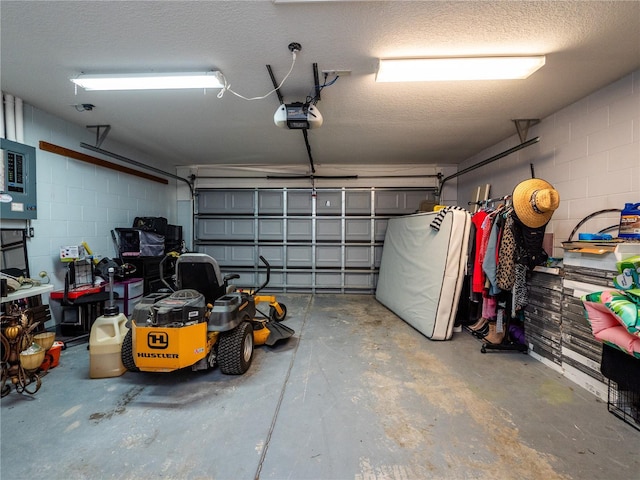 12805 SW 64th Ln, Ocala, FL 34481 - garage featuring a garage door opener and concrete block wall