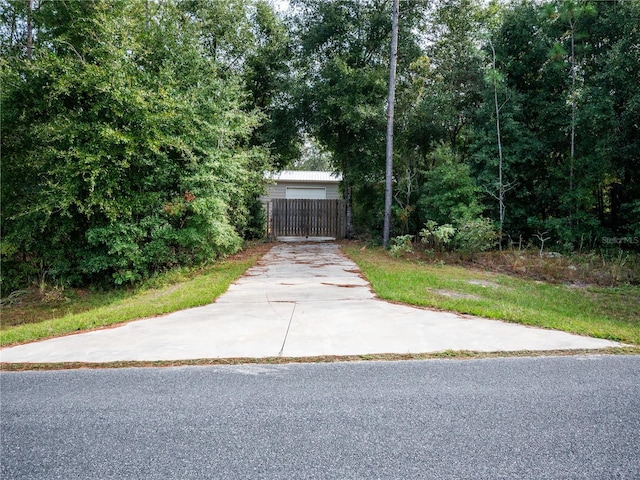 12805 SW 64th Ln, Ocala, FL 34481 - view of concrete surface featuring a gate