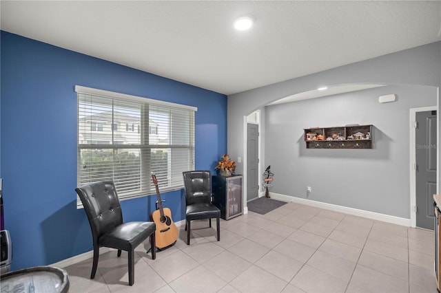 living area featuring light tile patterned floors