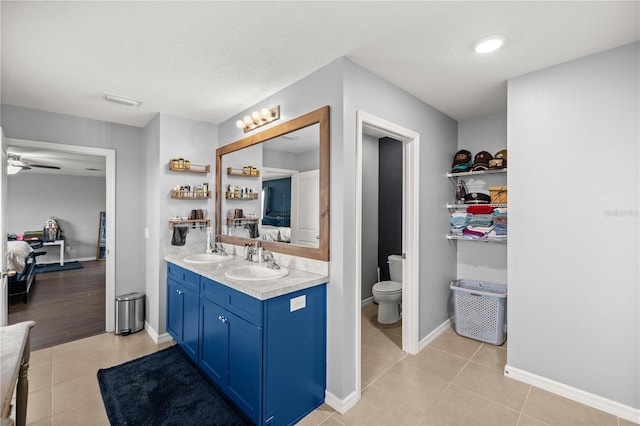 bathroom featuring vanity, toilet, hardwood / wood-style flooring, and a textured ceiling