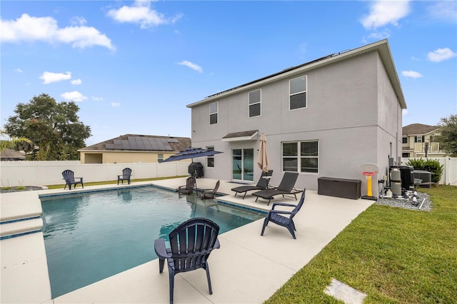 view of pool featuring a yard and a patio area