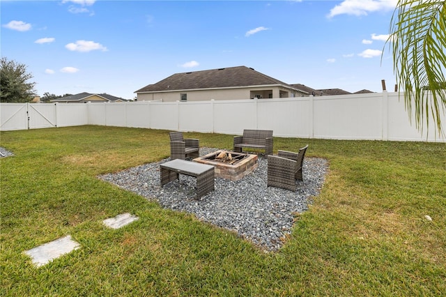 view of yard featuring an outdoor fire pit