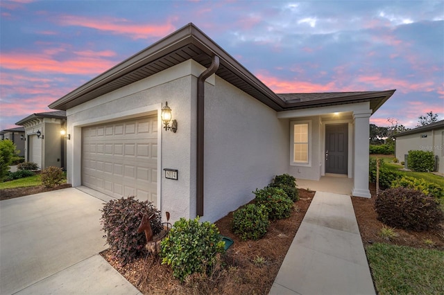 ranch-style house featuring a garage