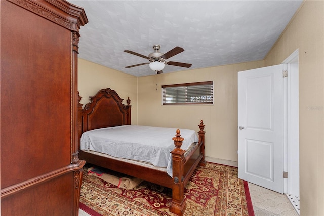 bedroom featuring a textured ceiling and ceiling fan