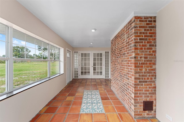 unfurnished sunroom with french doors and plenty of natural light