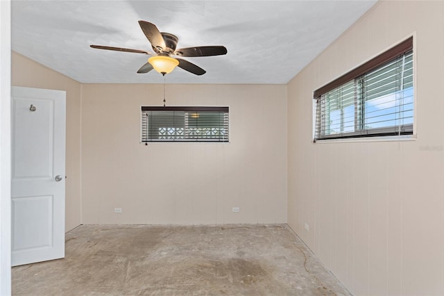 empty room featuring a textured ceiling and ceiling fan