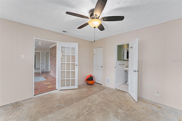 spare room with french doors and ceiling fan