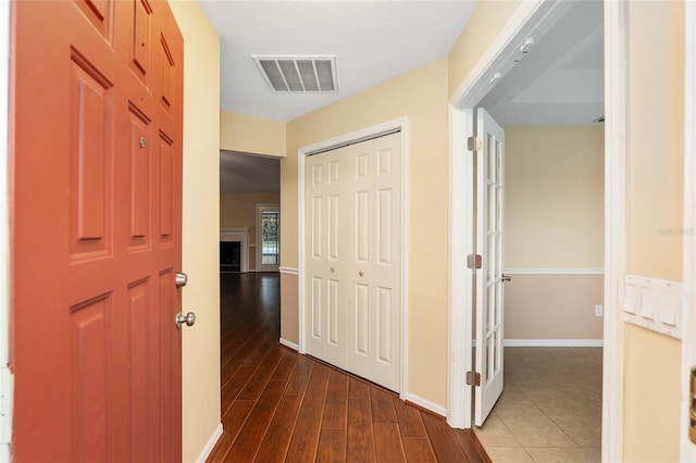 hallway with dark hardwood / wood-style floors