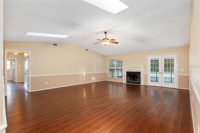 unfurnished living room featuring french doors, ceiling fan, vaulted ceiling, and dark hardwood / wood-style flooring