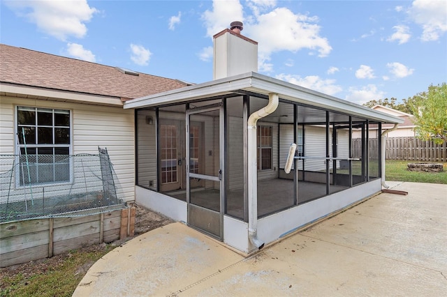 back of house featuring a patio and a sunroom