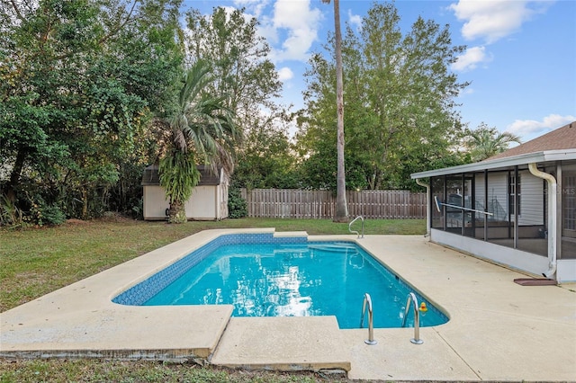 view of swimming pool with a patio area, a storage unit, and a sunroom