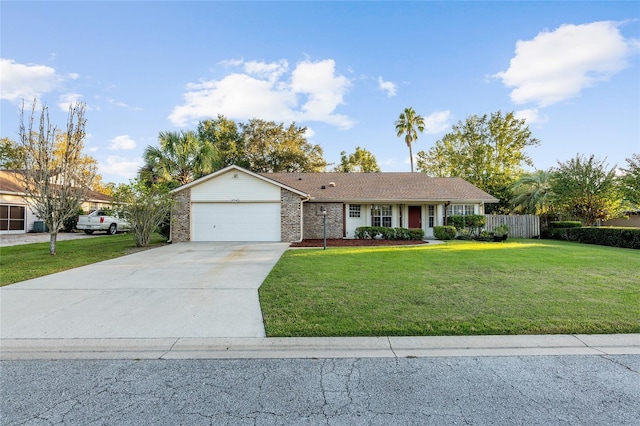 single story home featuring a front lawn and a garage