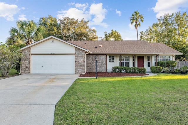 ranch-style home with a garage and a front lawn