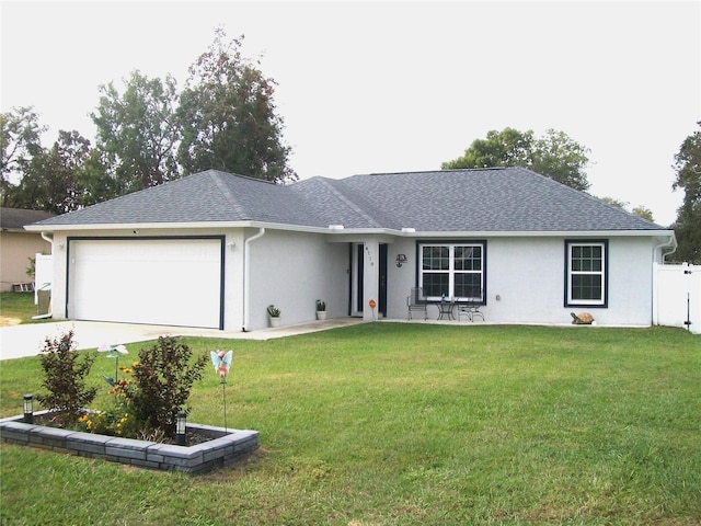 ranch-style house with a front yard and a garage