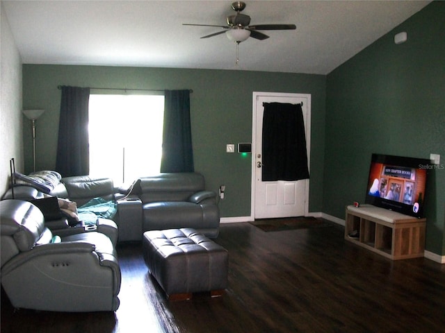 living room with vaulted ceiling, dark hardwood / wood-style flooring, and ceiling fan